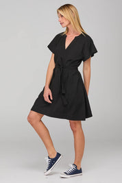 A model wearing the Livy Cotton Dress in colour Black (Black), from the front, showing the whole outfit