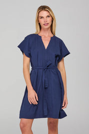 A model wearing the Livy Cotton Dress in colour Navy (Blue), from the front, cropped image