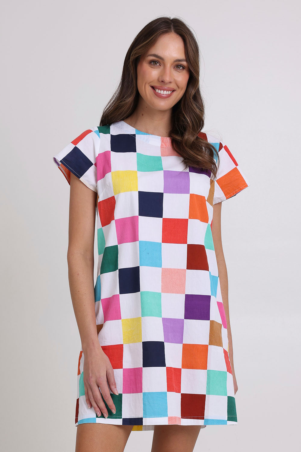 Model Madeline wearing size 10 of the Harper Cotton Dress in colour Gea, from the front, cropped image