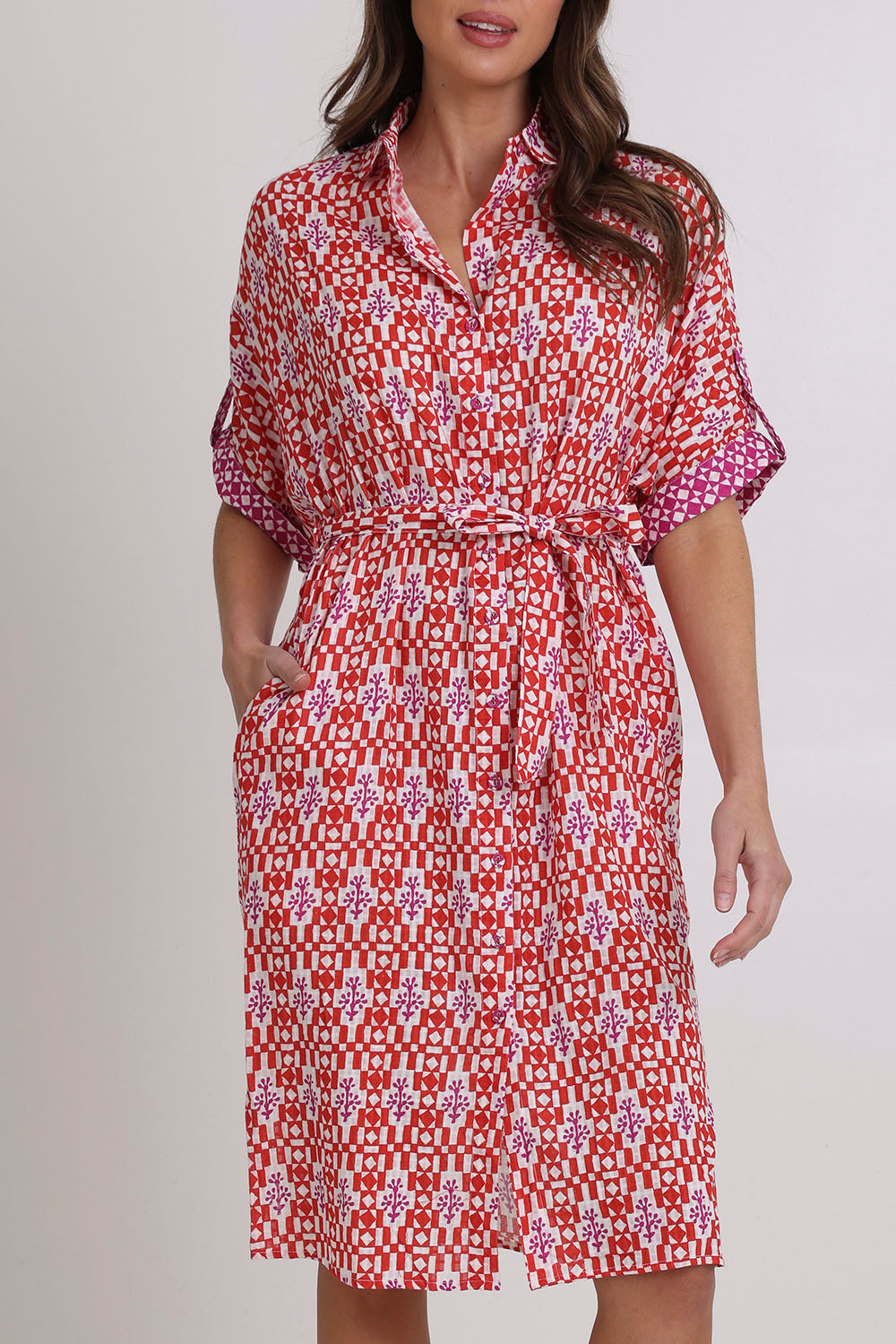 Model Madeline wearing size 10 of the Maui Cotton Shirt Dress in colour Naples (Pink), from the front, cropped image