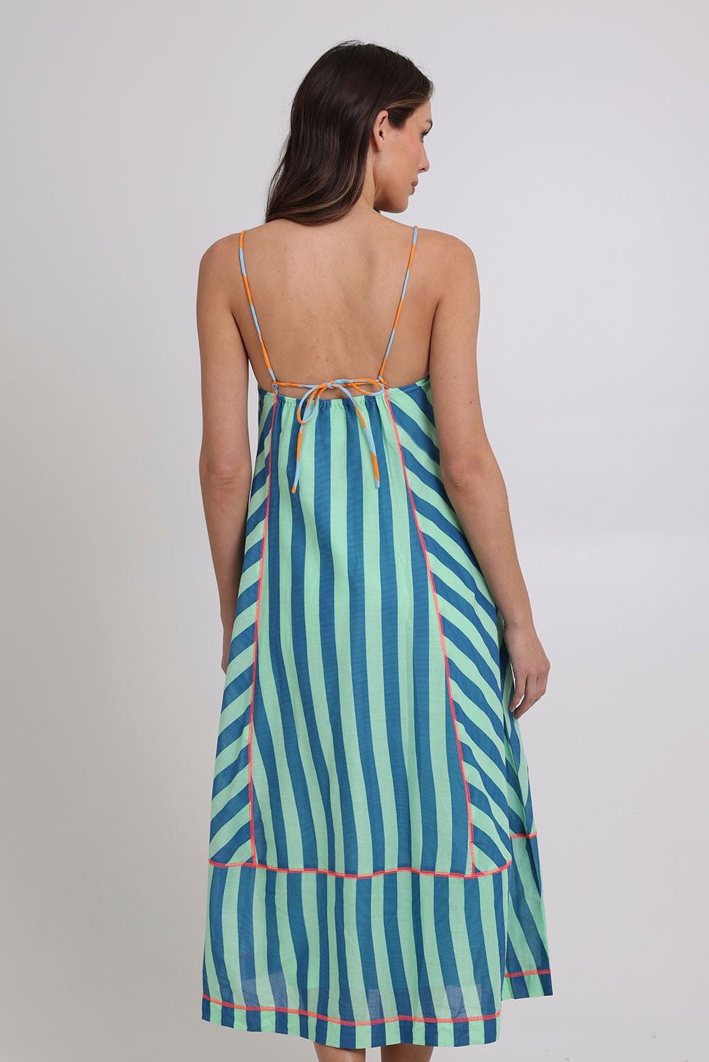 Model Madeline wearing size 10 of the Sami Cotton Dress in colour Capriblue (Blue), from the back