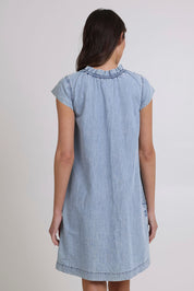 Model Madeline wearing size 10 of the Sand Lyocell Dress in colour Comoda (Blue), from the back