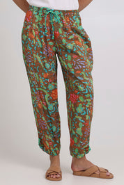 Model Madeline wearing size 10 of the Rimi Pant in colour Rimi (Green), from the front, cropped image