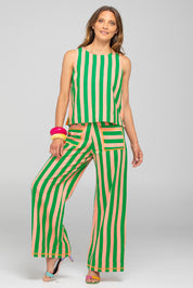 A model wearing the Sana Cotton Pant in colour Capri (Green), from the front, showing the whole outfit