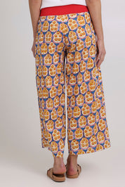 Model Madeline wearing size 10 of the Ria Cotton Pant in colour Emiliab, from the back