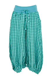 Product shot of the Guru Cotton Pant in colour Green (Green), from the front