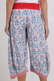 Model Madeline wearing size 10 of the Cuba Cotton Guru Pant in colour Emiliaw (Blue), from the back