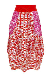 Product shot of the Guru Cotton Skirt in colour Splicenap (Pink), from the front