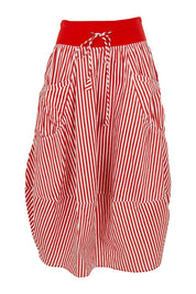 Product shot of the Guru Cotton Skirt in colour Emilias (Red), from the front