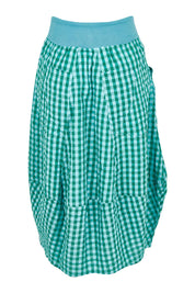 Product shot of the Guru Cotton Skirt in colour Green (Green), from the back
