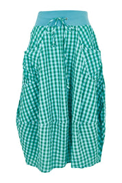 Product shot of the Guru Cotton Skirt in colour Green (Green), from the front