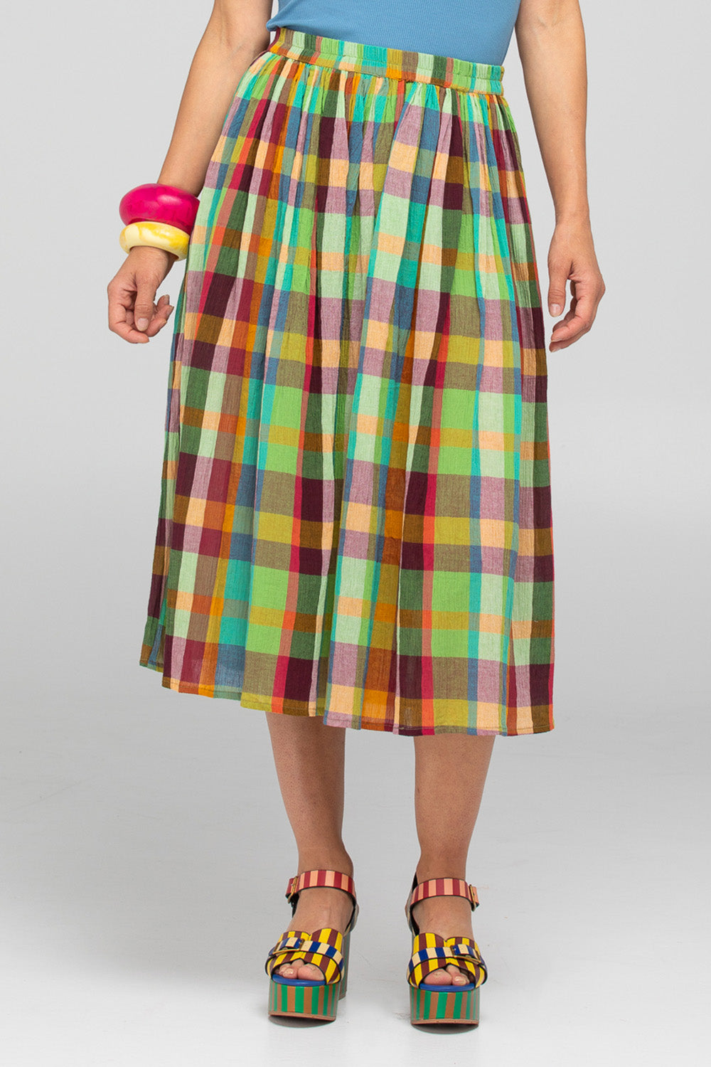 A model wearing the Sami Cotton Skirt in colour Isabella, from the front, cropped image