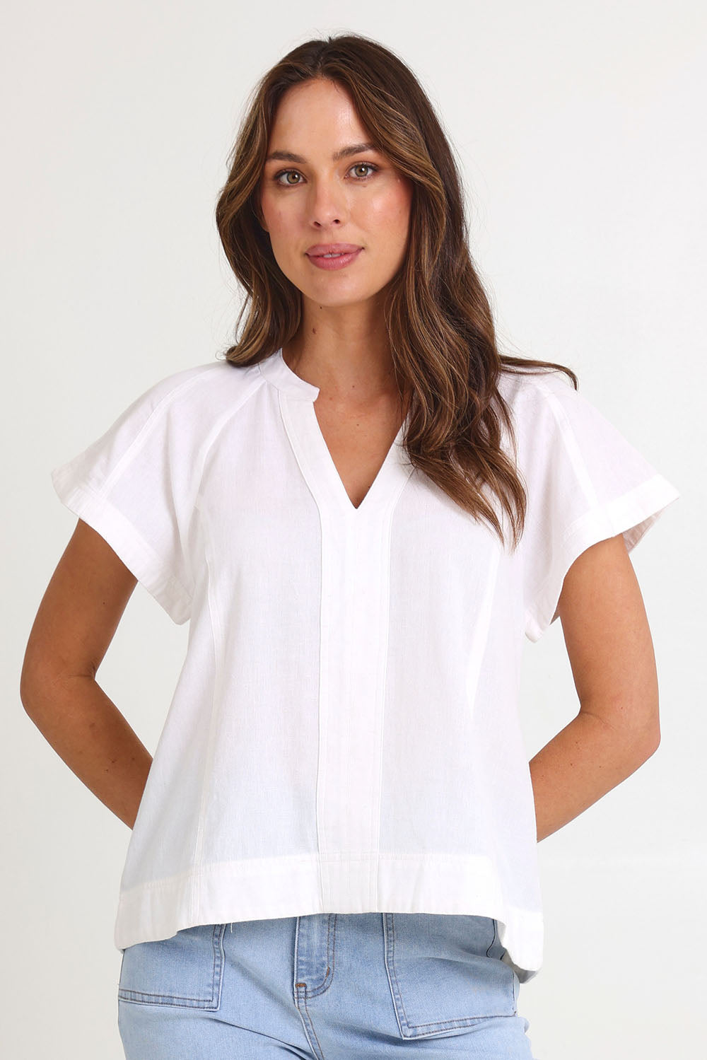 Model Madeline wearing size 10 of the Livy Cotton Top in colour White (White), from the front, cropped image