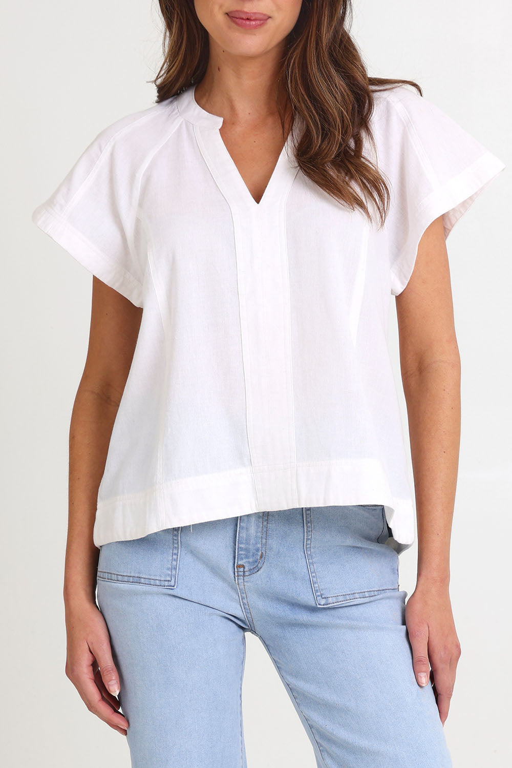 Model Madeline wearing size 10 of the Livy Cotton Top in colour White (White), from the front, cropped image