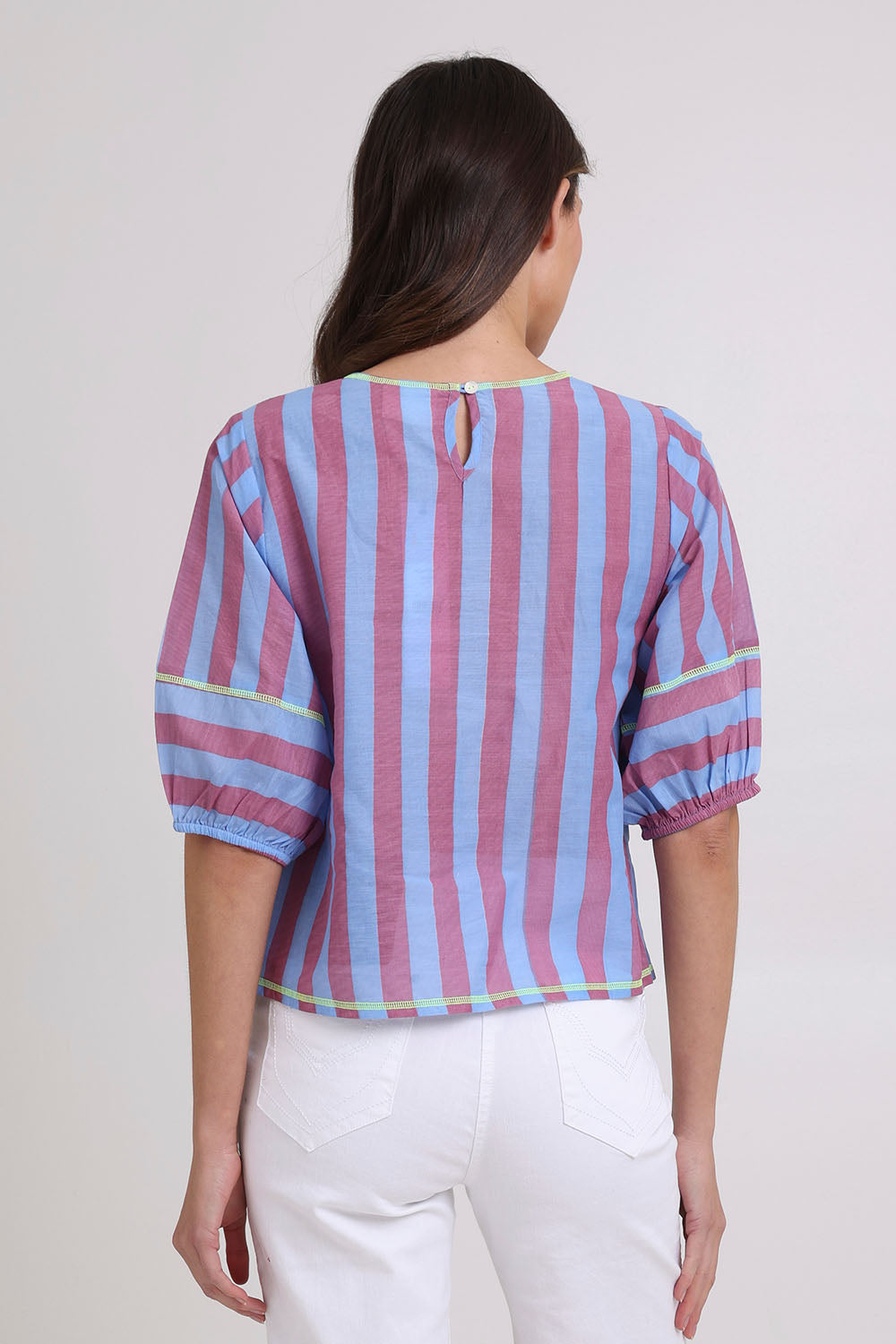 Model Madeline wearing size 10 of the Ava Cotton Top in colour Capriblue (Blue), from the back