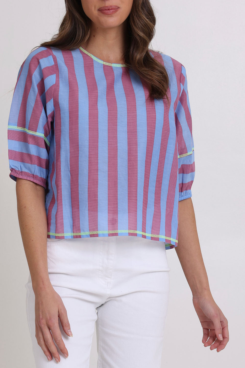 Model Madeline wearing size 10 of the Ava Cotton Top in colour Capriblue (Blue), from the front, cropped image