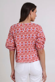 Model Madeline wearing size 10 of the Ava Cotton Top in colour Naples (Pink), from the back