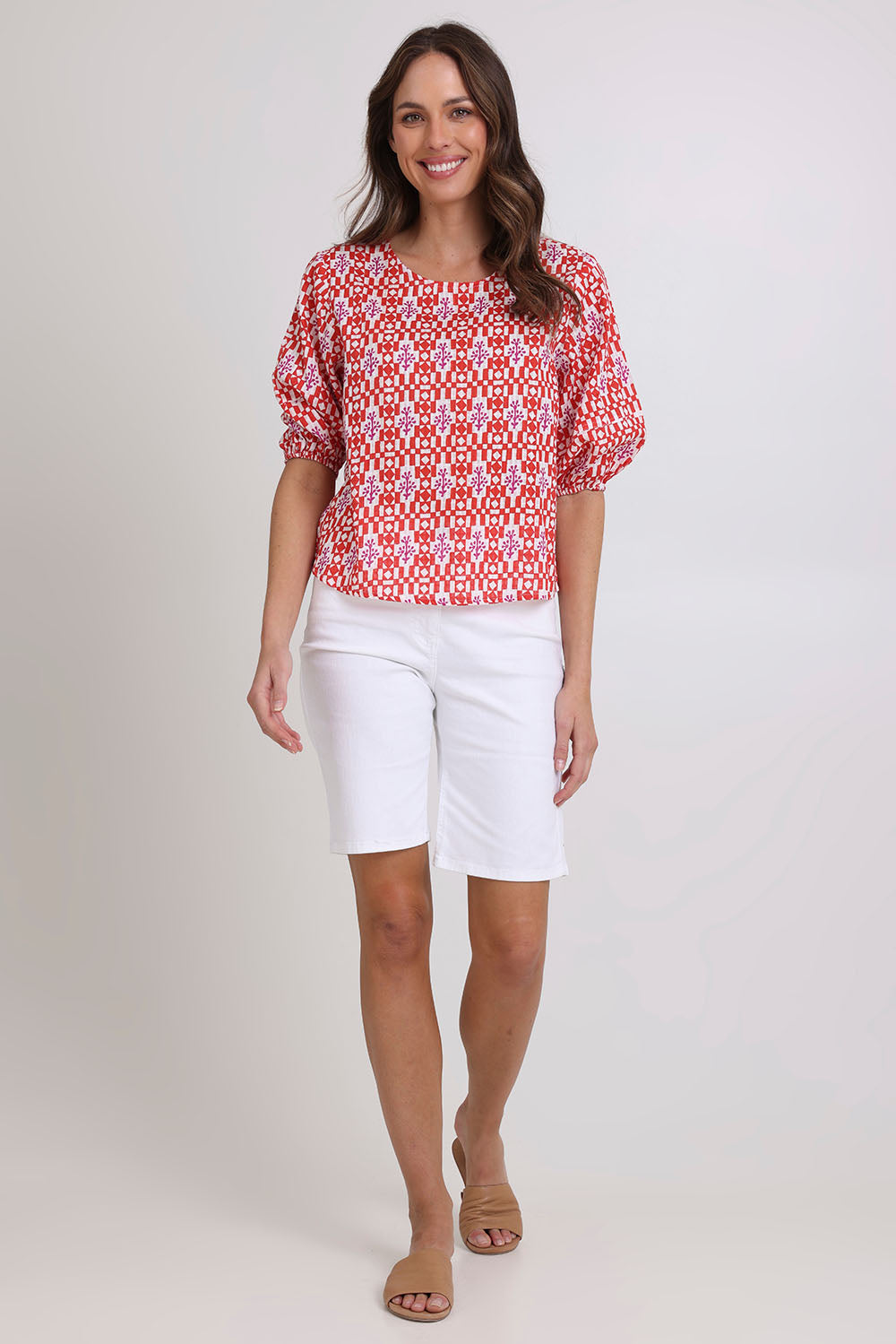 Model Madeline wearing size 10 of the Ava Cotton Top in colour Naples (Pink), from the front, showing the whole outfit
