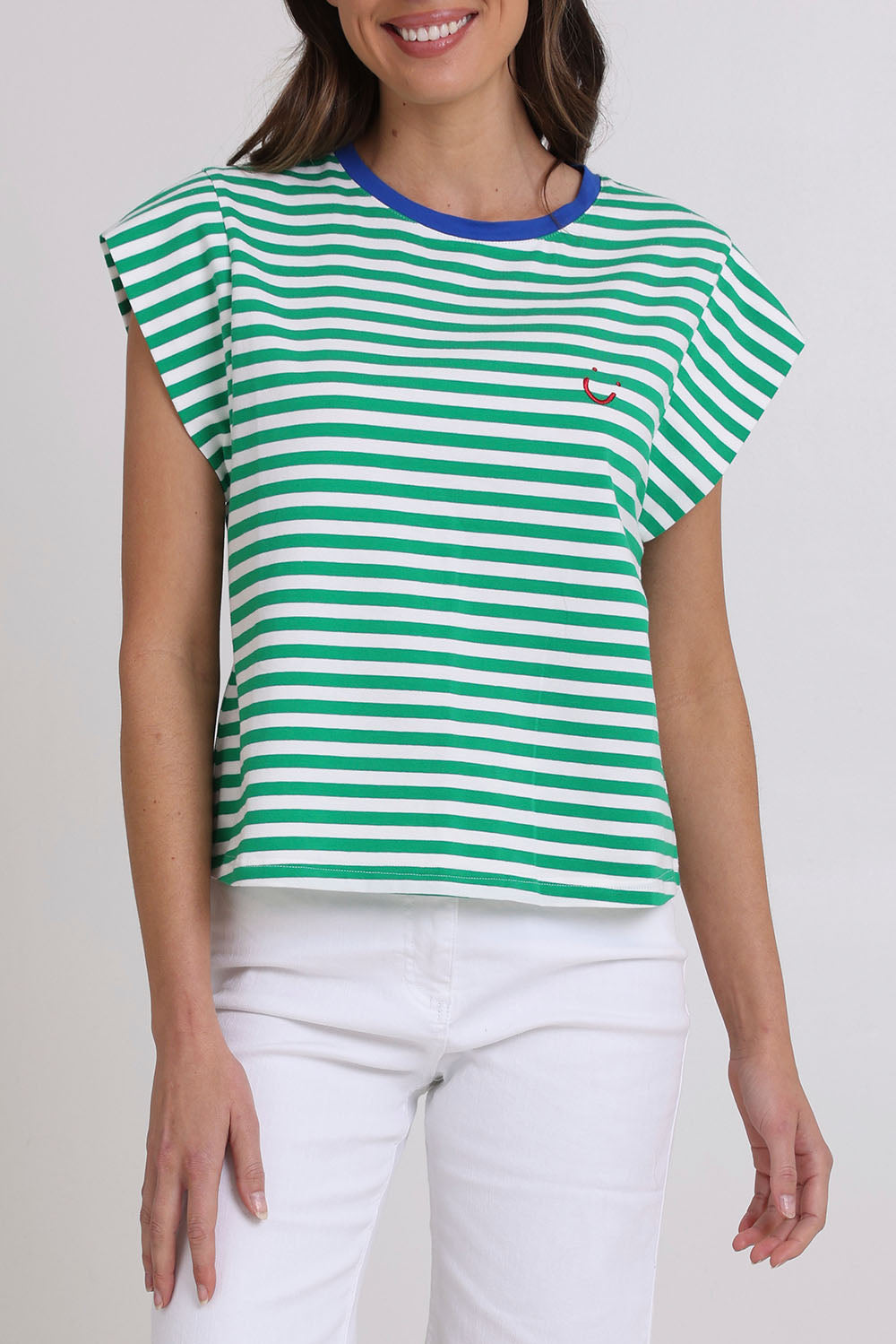 Model Madeline wearing size S of the Bellissimo Cotton Tee in colour Green (Green), from the front, cropped image