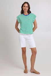 Model Madeline wearing size S of the Bellissimo Cotton Tee in colour Green (Green), from the front, showing the whole outfit