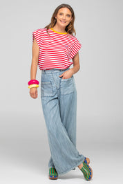 A model wearing the Bellissimo Cotton Tee in colour Redstripe (Red), from the front, showing the whole outfit