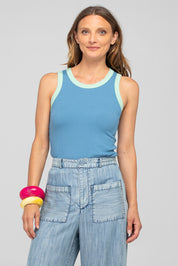 A model wearing the Bellissimo Tank Top in colour Dustyblue (Blue), from the front, cropped image