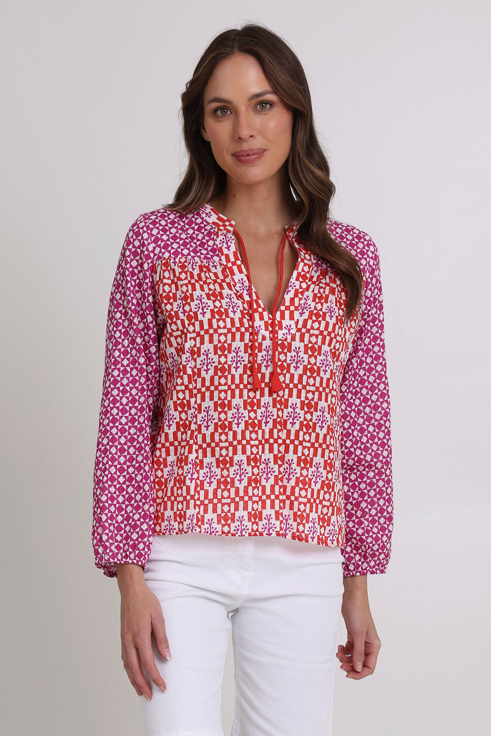 Model Madeline wearing size 10 of the Fleetwood Cotton Top in colour Naples (Pink), from the front, cropped image