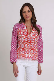 Model Madeline wearing size 10 of the Fleetwood Cotton Top in colour Naples (Pink), from the front, cropped image