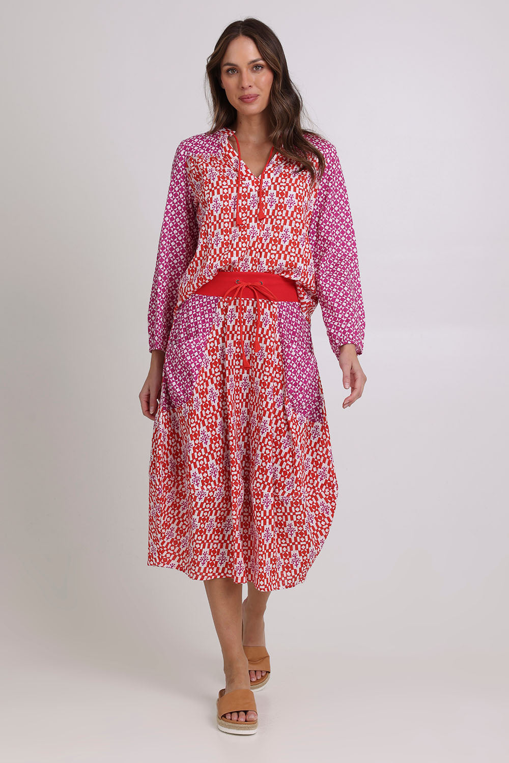Model Madeline wearing size 10 of the Fleetwood Cotton Top in colour Naples (Pink), from the front, showing the whole outfit