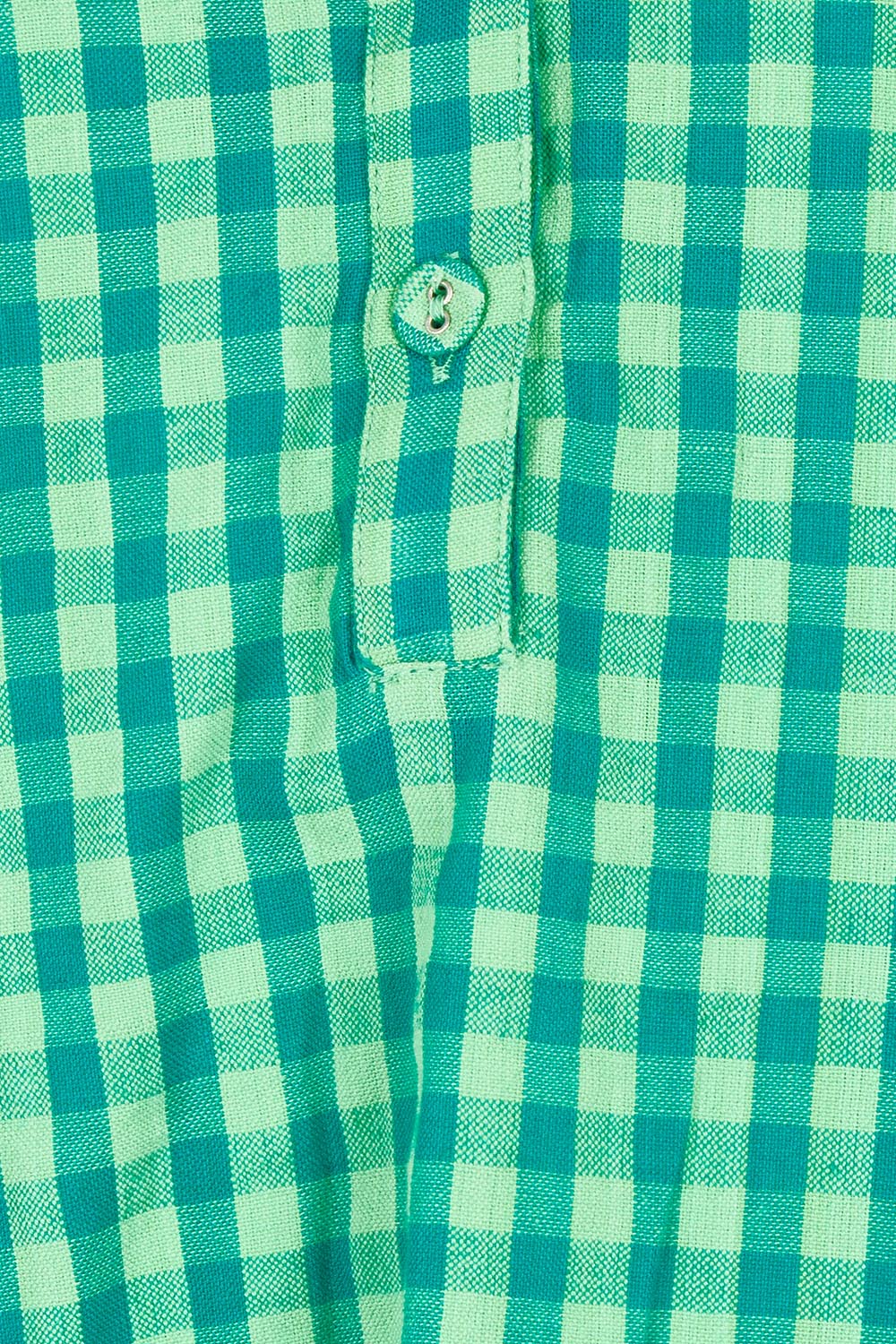 Product shot of the Cecilia Cotton Top in colour Verde (Green), detail