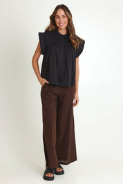 Model Madeline wearing size 10 of the Danika Cotton Top in colour Black (Black), from the front, showing the whole outfit
