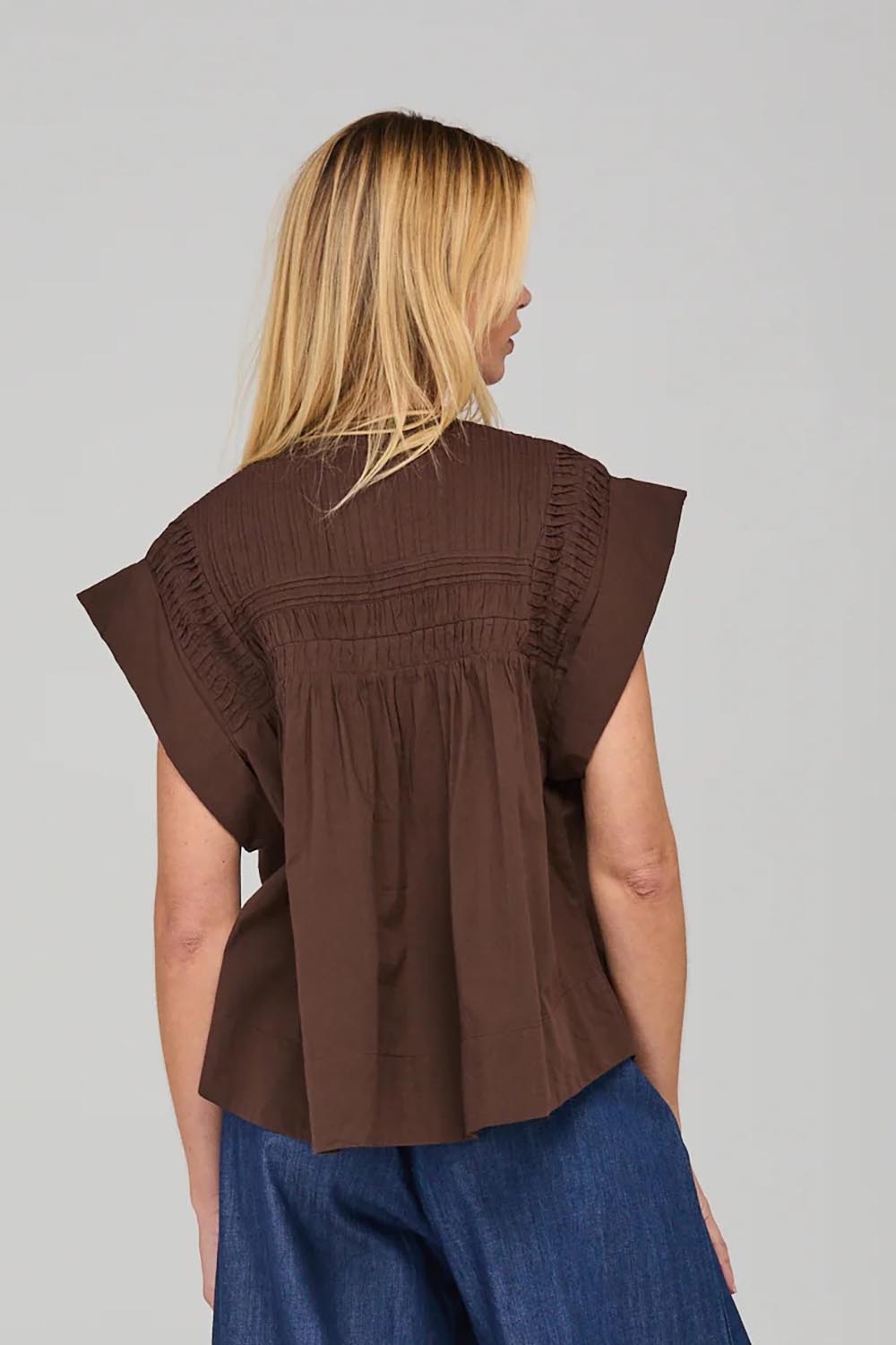 A model wearing the Danika Cotton Top in colour Coffee, from the back