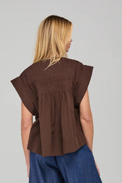 A model wearing the Danika Cotton Top in colour Coffee, from the back