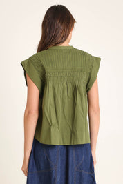 Model Madeline wearing size 10 of the Danika Cotton Top in colour Khaki (Green), from the back