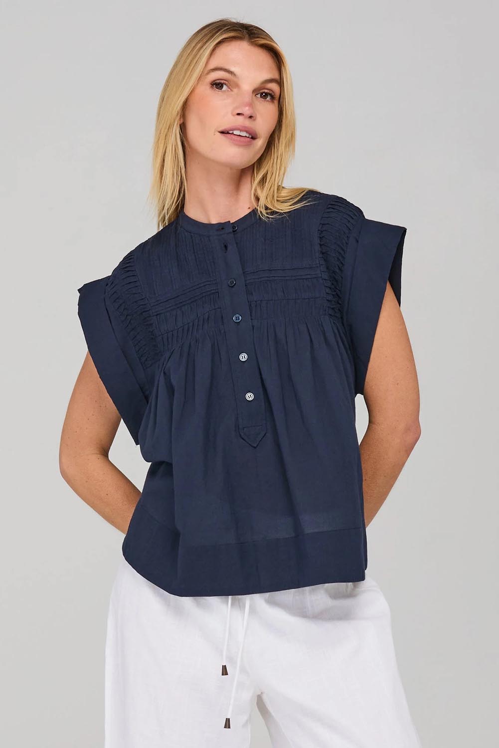 A model wearing the Danika Cotton Top in colour Navy (Blue), from the front, cropped image