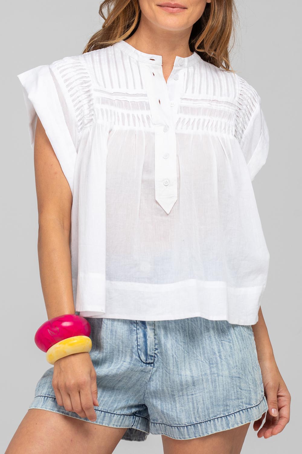 A model wearing the Danika Cotton Top in colour White (White), from the front, cropped image
