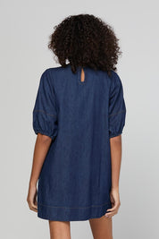 Model Genericm wearing size sample of the Ava Dress – Darkdenim in colour Darkdenim, from the back