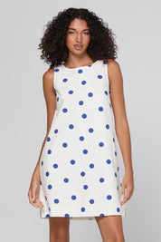 Model Genericm wearing size sample of the Hara Dress – Polkadot in colour Polkadot, in a cropped view