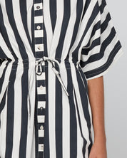 Model Genericm wearing size sample of the Shiro Shirt Dress – Mono in colour Mono, in a cropped view