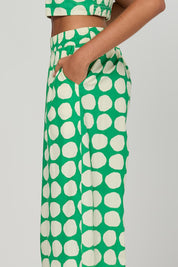 Model Genericm wearing size sample of the Carmen Pant - Circulo in colour Circulo, from an angle