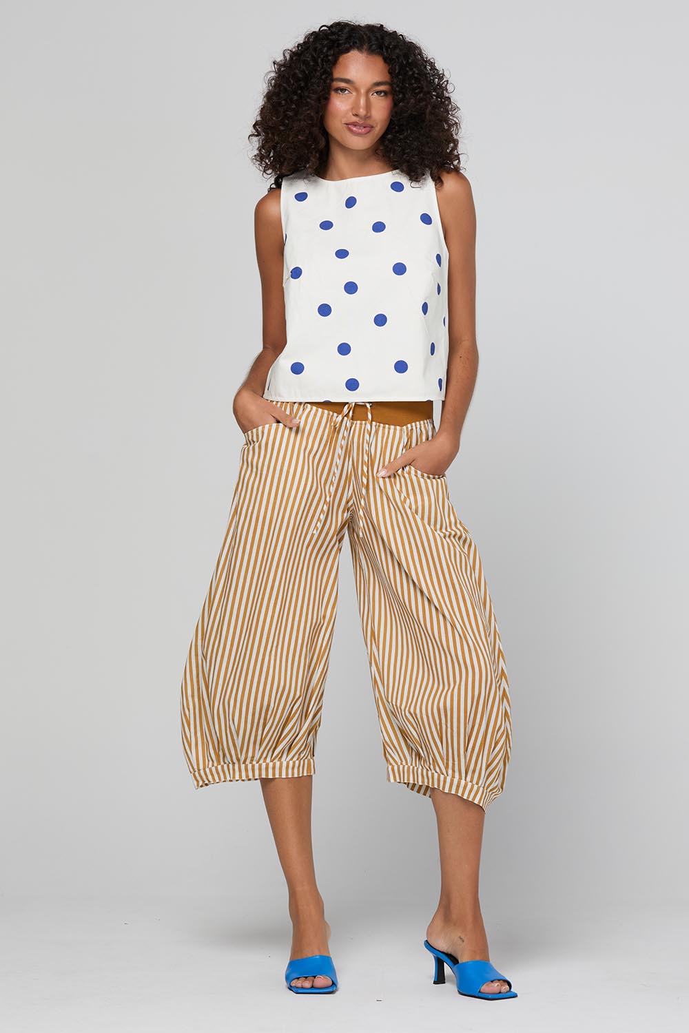 Model Genericm wearing size sample of the Guru Pant – Mustard in colour Mustard, from the front