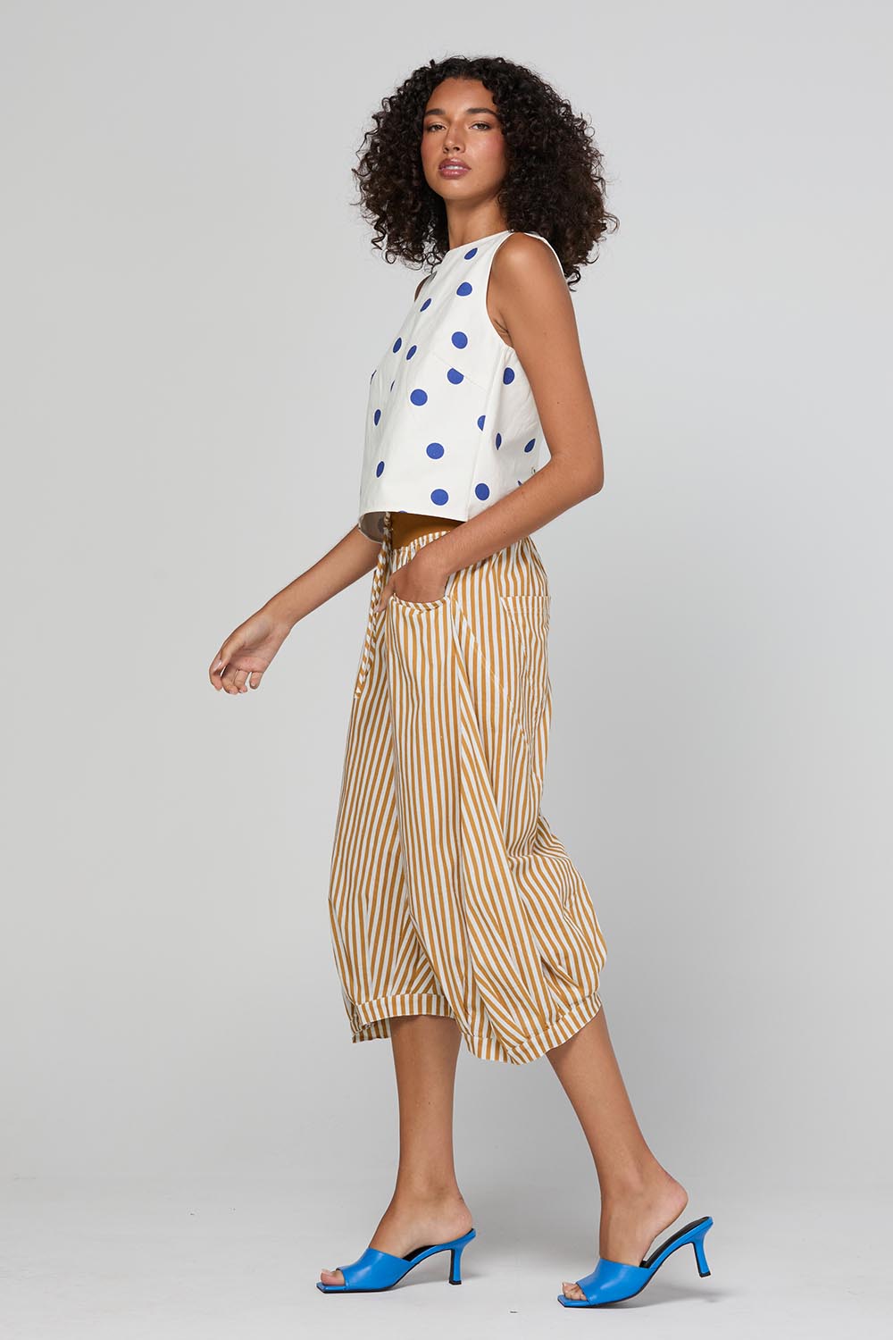 Model Genericm wearing size sample of the Guru Pant – Mustard in colour Mustard, from the front