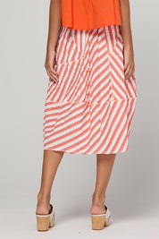 Model Genericm wearing size sample of the Guru Skirt – Watermelon in colour Watermelon, from the back