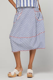 Model Genericm wearing size sample of the Guru Skirt – Ocean in colour Ocean, from an angle