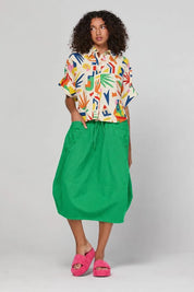 Model Genericm wearing size sample of the Guru Skirt – Apple in colour Apple, from the front