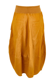 Product shot of the Guru Skirt – Turmeric in colour Turmeric, from the back