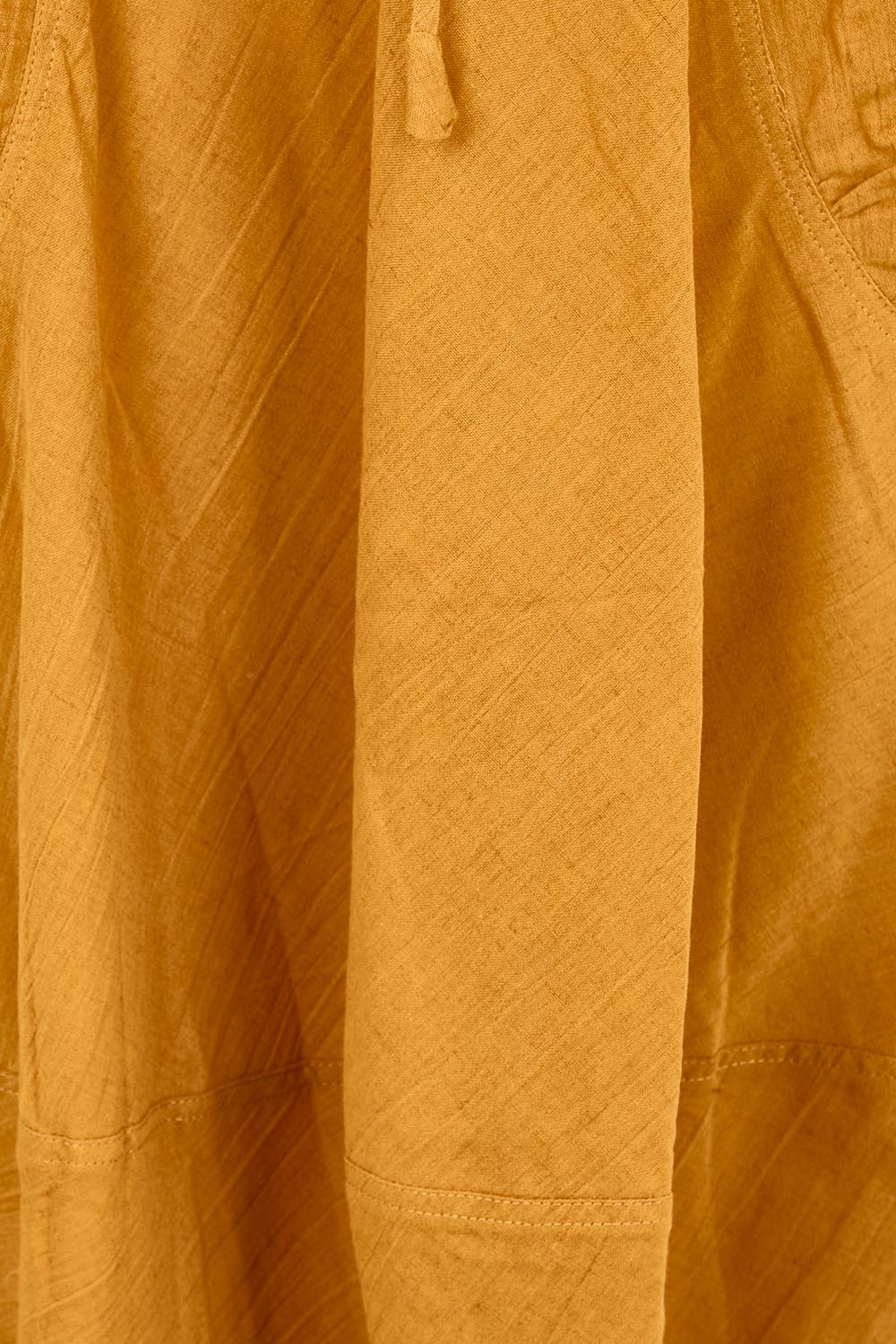 Product shot of the Guru Skirt – Turmeric in colour Turmeric, showing detail