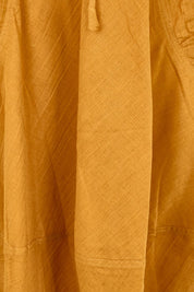 Product shot of the Guru Skirt – Turmeric in colour Turmeric, showing detail