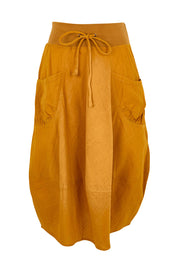 Product shot of the Guru Skirt – Turmeric in colour Turmeric, from the front
