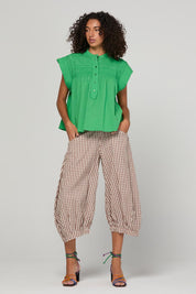 Model Genericm wearing size sample of the Danika Top – Apple in colour Apple, from the front